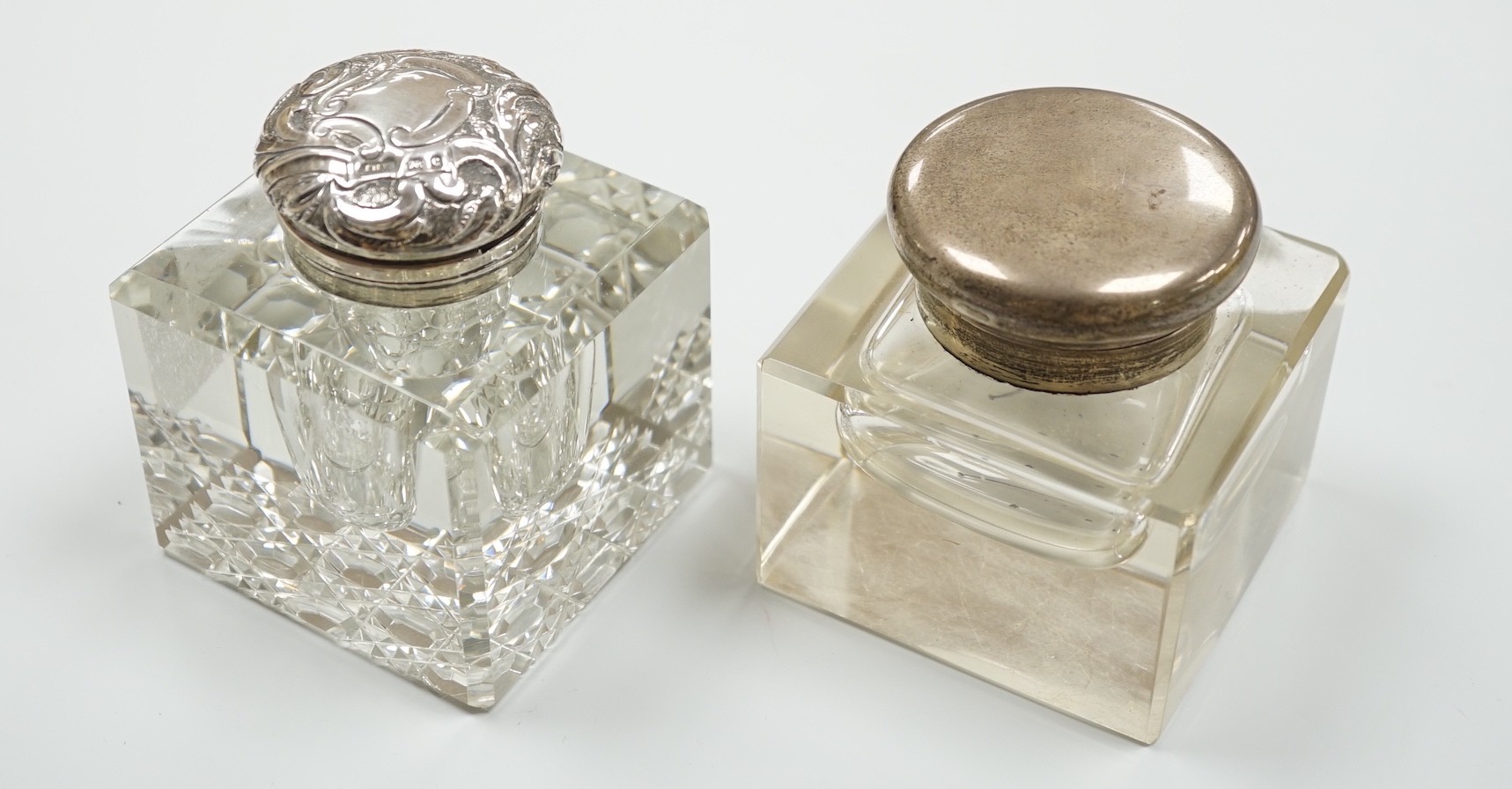 Two silver mounted cut glass inkwells, including Birmingham, 1902, height 92mm.